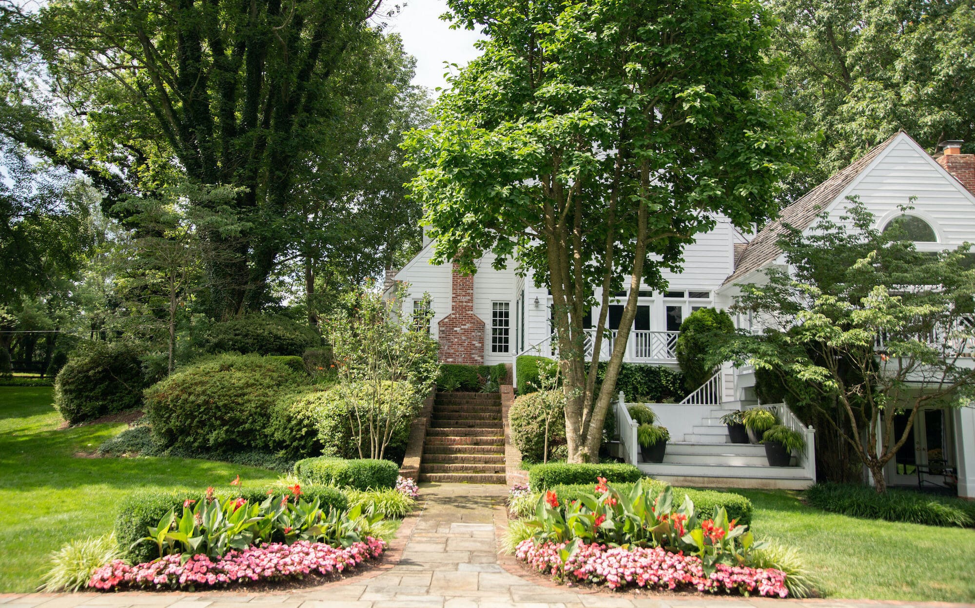 landscape design with trees and flower beds in Great Falls, VA